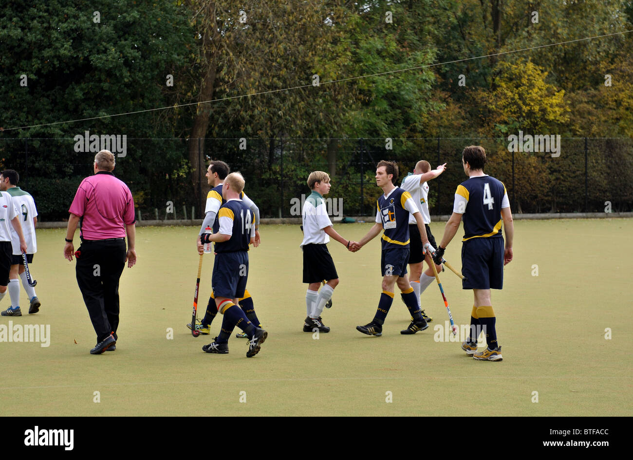 Men`s hockey at club level. Players after match including shaking hands. Stock Photo